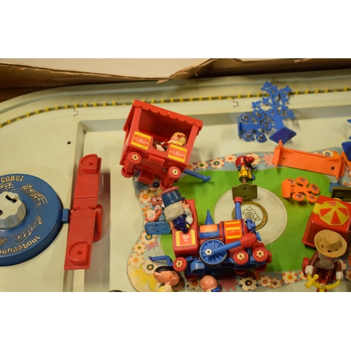 329 - Corgi Magic Roundabout Playground 853 with Merry Go Round and musical element with figures and decor... 