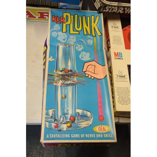 332 - A collection of vintage children's board games and similar to include Kerplunk, Downfall, Hangman, M... 