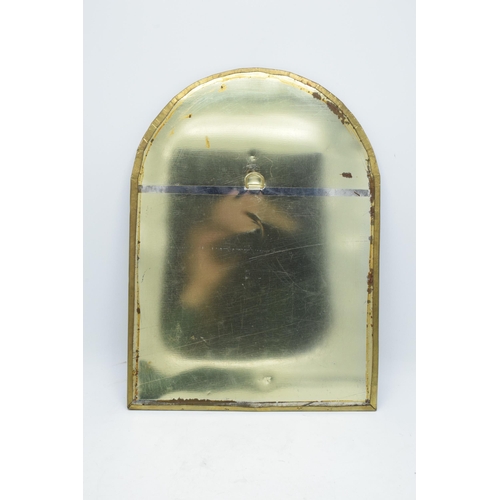 334 - A 20th century arched brass mirror with embossed decoration. 37 x 27cm.