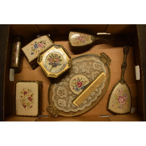 347 - A 20th century ornate gilt metal dressing table set to include a tray, brushes, clock, trinkets etc.... 