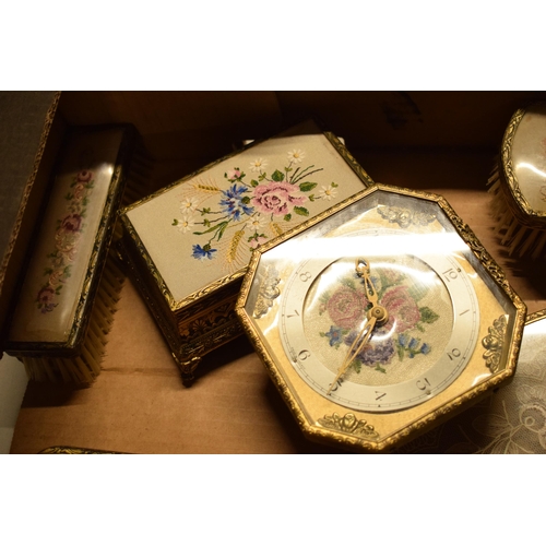 347 - A 20th century ornate gilt metal dressing table set to include a tray, brushes, clock, trinkets etc.... 