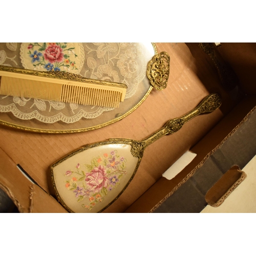 347 - A 20th century ornate gilt metal dressing table set to include a tray, brushes, clock, trinkets etc.... 