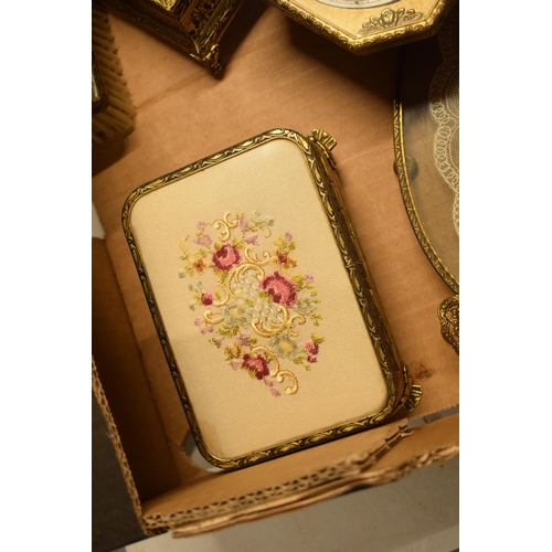 347 - A 20th century ornate gilt metal dressing table set to include a tray, brushes, clock, trinkets etc.... 