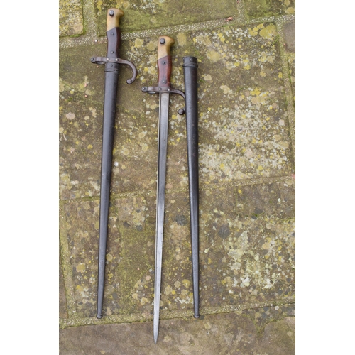 378 - A pair of antique French bayonets (2). One with inscription 'Mre D'Armes de Tulle Janvier 1880' with... 