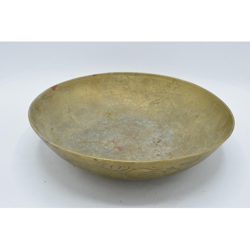 387 - A 20th century brass bowl with Chinese markings and decoration. 30cm diameter.