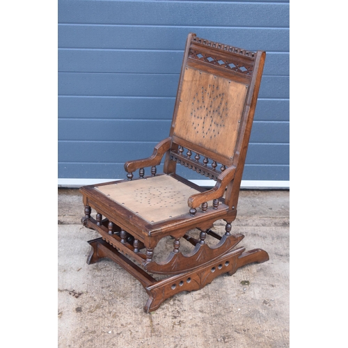 390 - Edwardian wooden spring-action American-style rocking chair with turned decoration. 96cm tall. In go... 