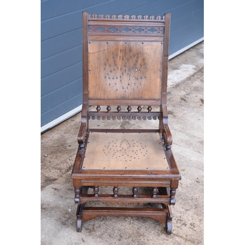 390 - Edwardian wooden spring-action American-style rocking chair with turned decoration. 96cm tall. In go... 