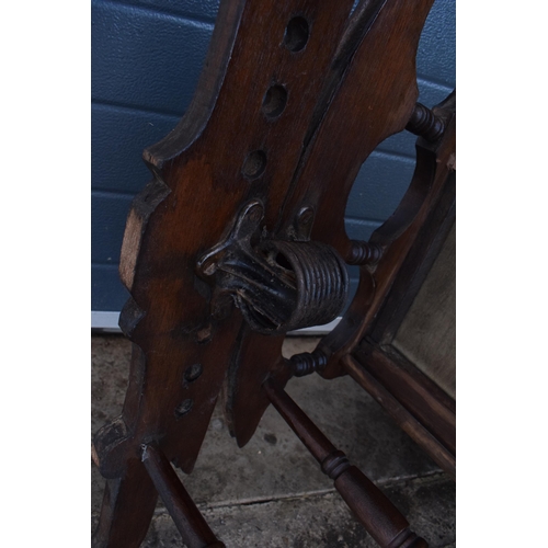 390 - Edwardian wooden spring-action American-style rocking chair with turned decoration. 96cm tall. In go... 