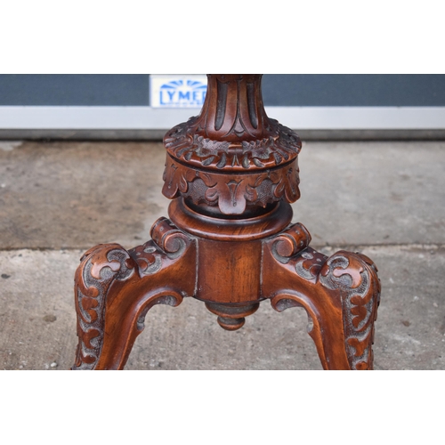 391 - A 19th century walnut carved piano stool with upholstered adjustable seat together with a matching c... 