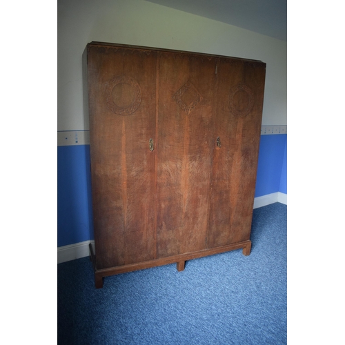 393 - Early 20th century wooden triple wardrobe with decoration to panels. 154 x 48 x 187cm tall. In good ... 