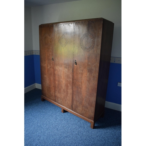 393 - Early 20th century wooden triple wardrobe with decoration to panels. 154 x 48 x 187cm tall. In good ... 