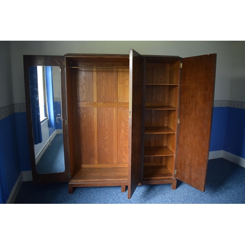 393 - Early 20th century wooden triple wardrobe with decoration to panels. 154 x 48 x 187cm tall. In good ... 