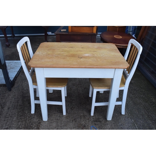 395 - A 20th century pine-topped kitchen table with a single draw and 2 dining chairs decorated with a vin... 