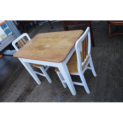 395 - A 20th century pine-topped kitchen table with a single draw and 2 dining chairs decorated with a vin... 