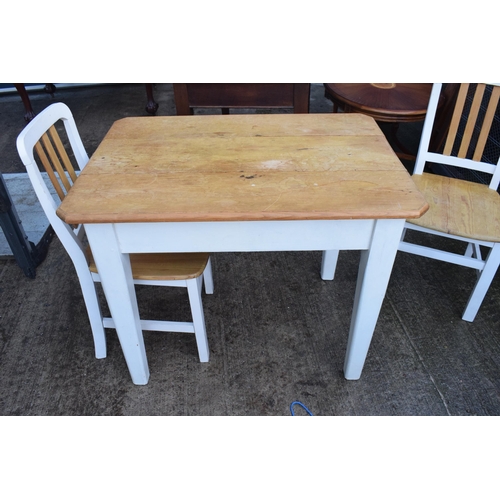 395 - A 20th century pine-topped kitchen table with a single draw and 2 dining chairs decorated with a vin... 