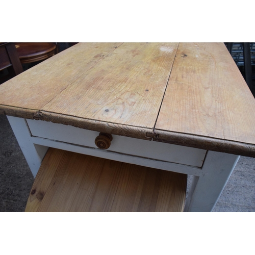 395 - A 20th century pine-topped kitchen table with a single draw and 2 dining chairs decorated with a vin... 