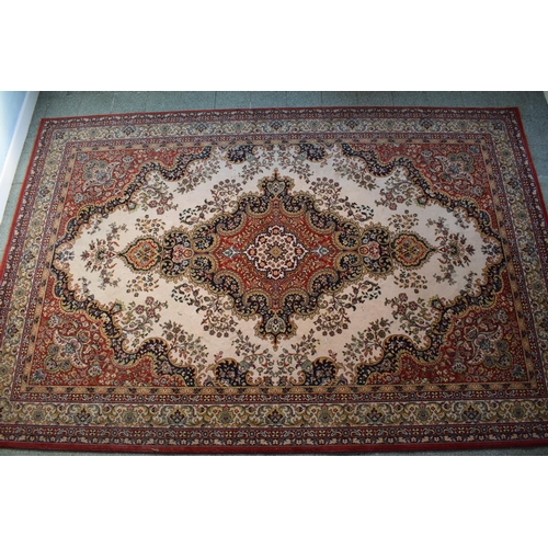 423 - A large 20th century rectangular carpet. 307 x 199cm. in good condition generally with some stains a... 