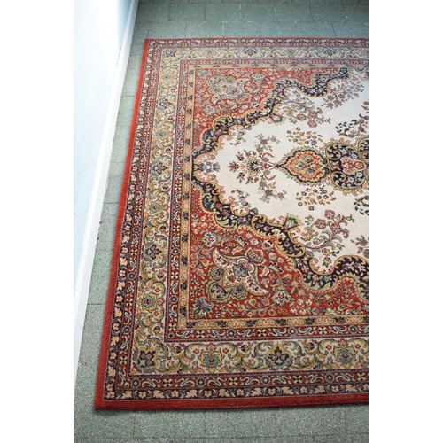 423 - A large 20th century rectangular carpet. 307 x 199cm. in good condition generally with some stains a... 