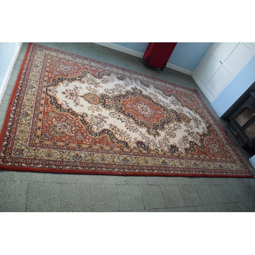 423 - A large 20th century rectangular carpet. 307 x 199cm. in good condition generally with some stains a... 