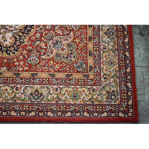 423 - A large 20th century rectangular carpet. 307 x 199cm. in good condition generally with some stains a... 