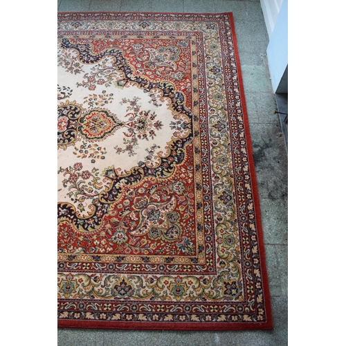 423 - A large 20th century rectangular carpet. 307 x 199cm. in good condition generally with some stains a... 