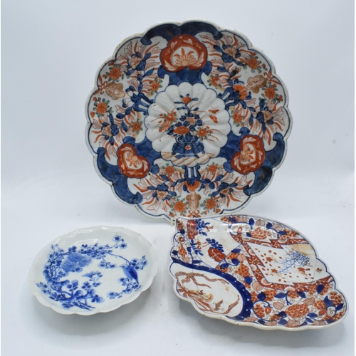 61 - A collection of oriental pottery to include 19th century Japanese items such as a shell shaped Imari... 