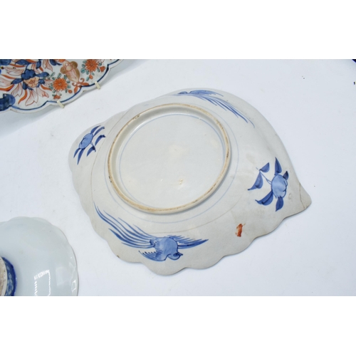 61 - A collection of oriental pottery to include 19th century Japanese items such as a shell shaped Imari... 