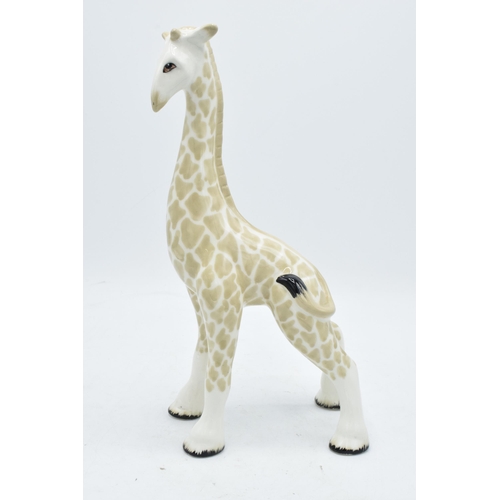 67 - Midwinter large pottery model of a giraffe. 30cm tall. In good condition with no obvious damage or r... 