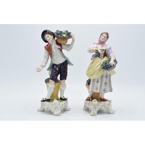 99 - A pair of Rudolf Kammer continental porcelain figures of grape pickers (2).  In good condition with ... 