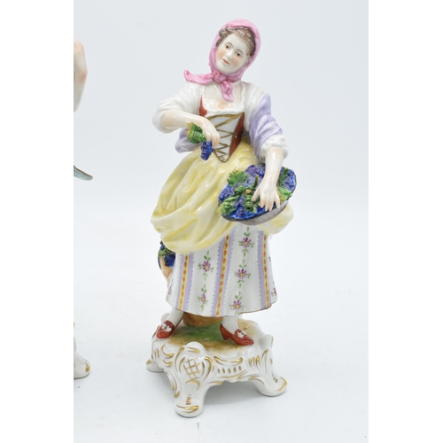 99 - A pair of Rudolf Kammer continental porcelain figures of grape pickers (2).  In good condition with ... 