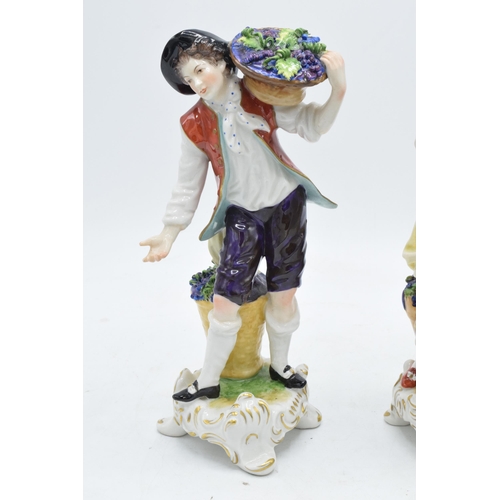 99 - A pair of Rudolf Kammer continental porcelain figures of grape pickers (2).  In good condition with ... 