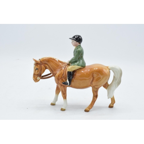 148L - Beswick boy on pony 1500. In good condition with no obvious damage or restoration though head has be... 