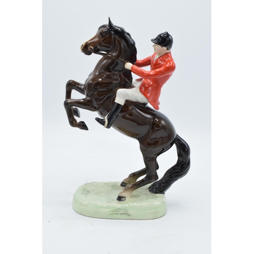 148P - Beswick rearing huntsman on brown horse 868. In good condition with no obvious damage or restoration... 