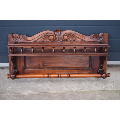 302 - An early 20th century wooden shelving unit / spice shelf with carved decoration and turned features.... 