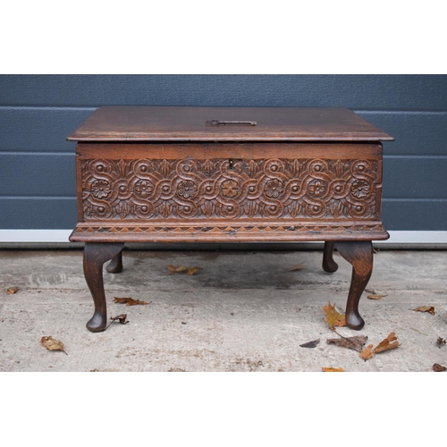 305 - A late 18th / 19th century oak bible box raised on cabriole style legs with heavy carved decoration ... 