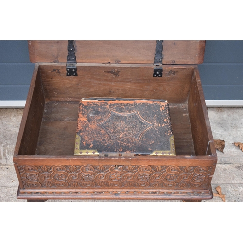 305 - A late 18th / 19th century oak bible box raised on cabriole style legs with heavy carved decoration ... 