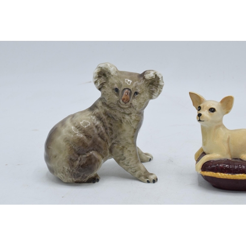 105 - A collection of Beswick to include a koala bear 1038, chihuahua on cushion 2454 and swan with head d... 