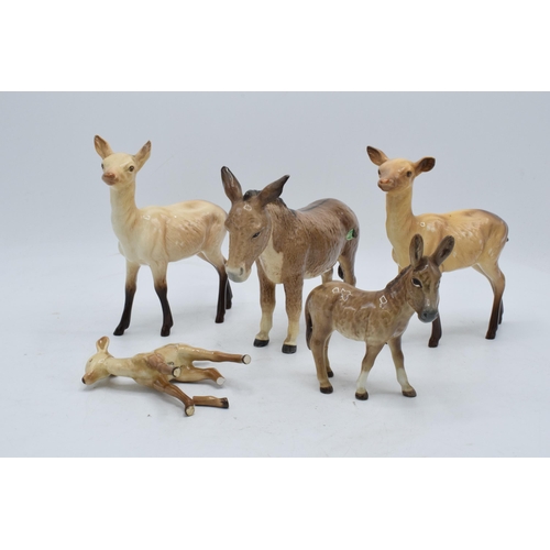 112 - A collection of Beswick to include 2 x does 999a, a fawn (af), a donkey 2267 and a donkey foal 2110 ... 