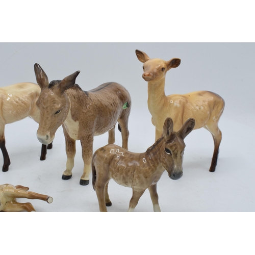 112 - A collection of Beswick to include 2 x does 999a, a fawn (af), a donkey 2267 and a donkey foal 2110 ... 