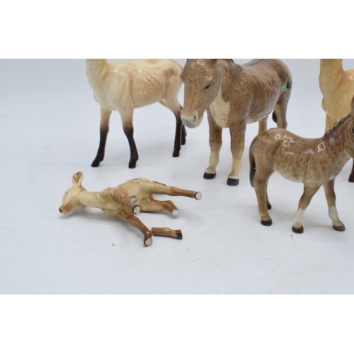 112 - A collection of Beswick to include 2 x does 999a, a fawn (af), a donkey 2267 and a donkey foal 2110 ... 