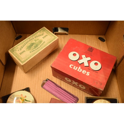 12 - A mixed collection of items to include a vintage Oxo tin, coin set, Stratton compacts, 'Two Scapegra... 