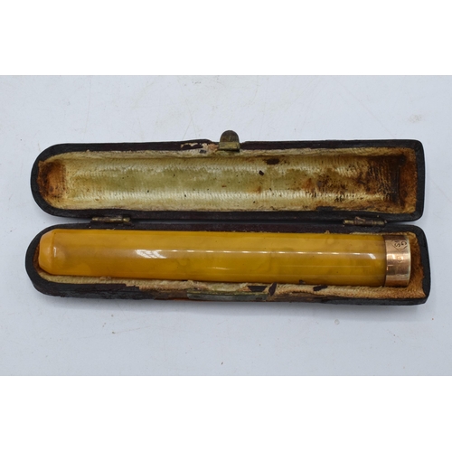 209 - A cased cheroot holder with a 15ct gold mount / collar.