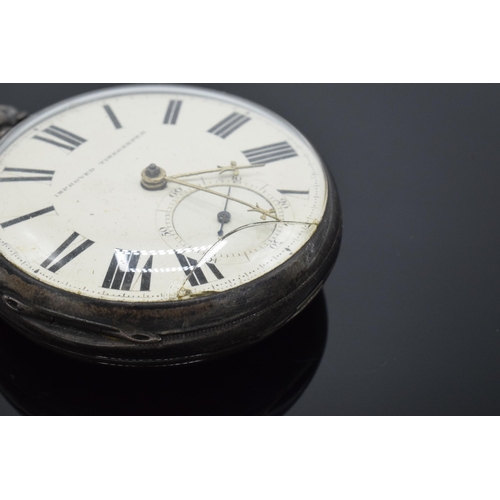 215 - A silver cased key-wind pocket watch 'Improved Timekeeper'. Untested. Small crack to the glass.