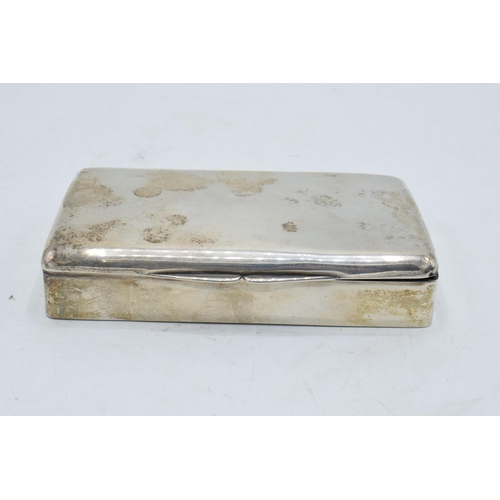 220 - A silver cigarette box with wooden lining. 14 x 8 x 3cm. In clean condition with some scratches and ... 