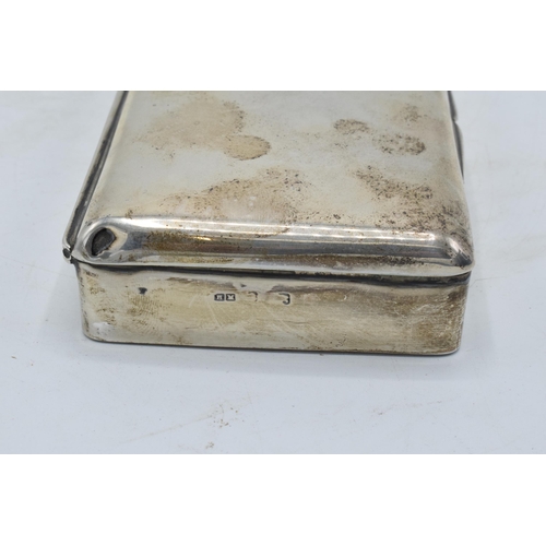 220 - A silver cigarette box with wooden lining. 14 x 8 x 3cm. In clean condition with some scratches and ... 