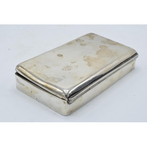 220 - A silver cigarette box with wooden lining. 14 x 8 x 3cm. In clean condition with some scratches and ... 