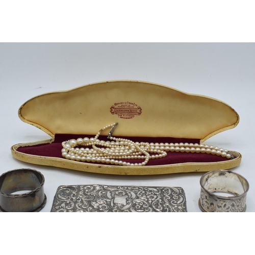 222 - A collection of silver items to include a silver-topped box, a silver napkin ring (14.3 grams), an E... 