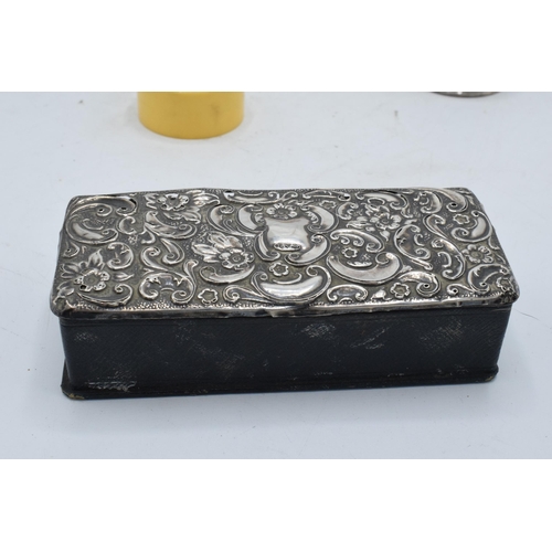 222 - A collection of silver items to include a silver-topped box, a silver napkin ring (14.3 grams), an E... 