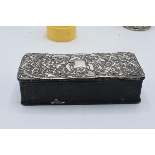 222 - A collection of silver items to include a silver-topped box, a silver napkin ring (14.3 grams), an E... 