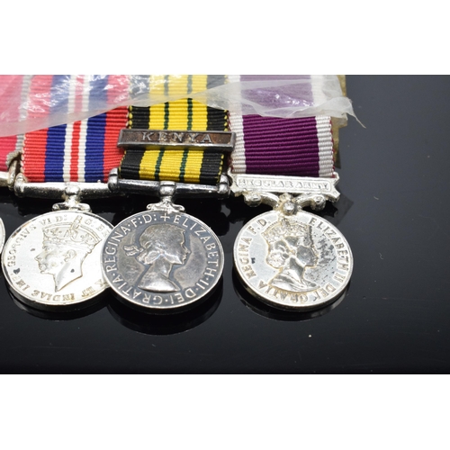 226 - A set of 4 miniature medals with ribbons to include Queen Elizabeth Kenya medal, QEII Regular Army m... 